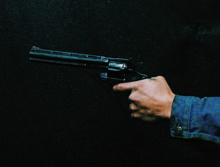 Hand Holding A Gun