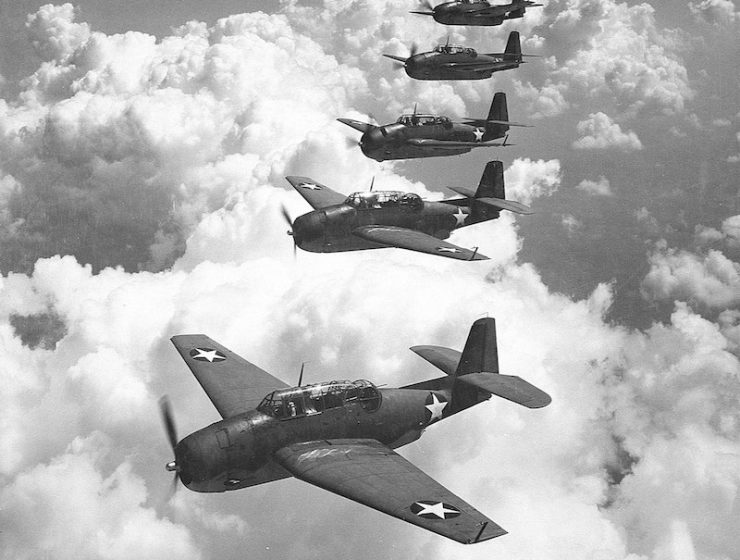 A similar flight of five Grumman TBF Avengers