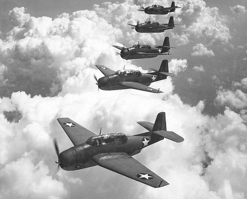 A similar flight of five Grumman TBF Avengers