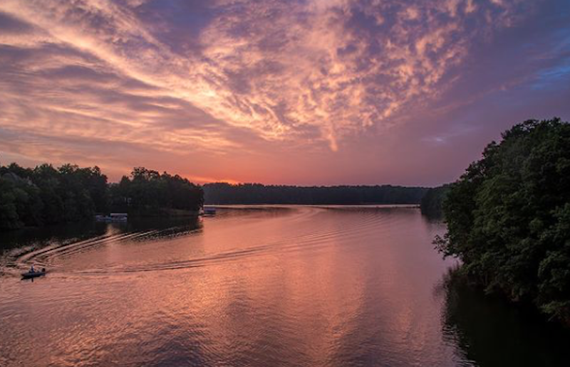 View Of A Small Boat During Sunset On lake Lanier